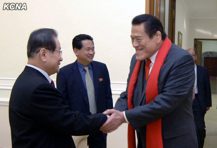 Antonio Inoki (R) shakes hands with KWP Secretary and Director of International Affairs Kim Yong Il (L) on 15 January 2013.