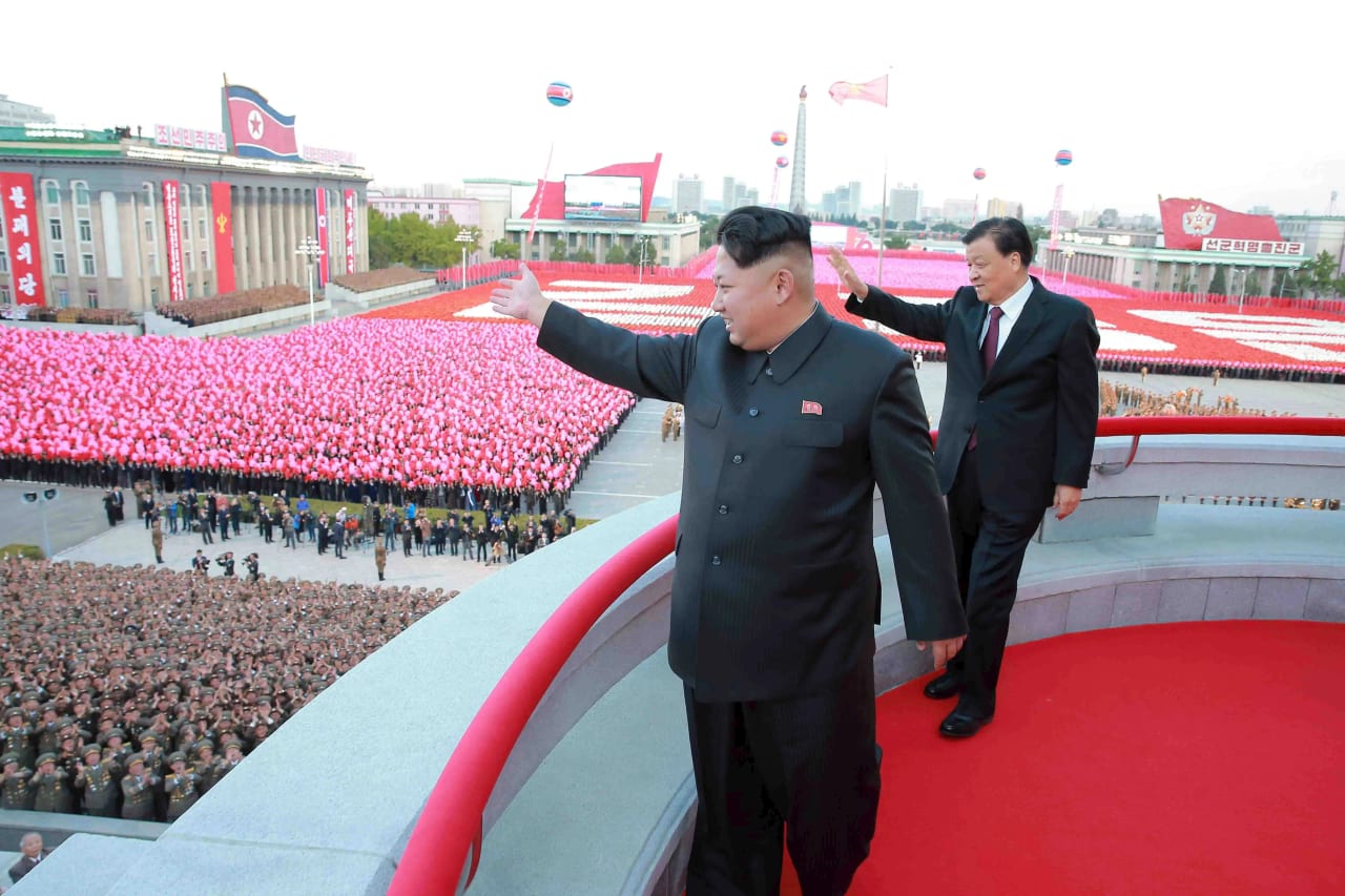 Kim Jong Un waving from the Grand People's Study House balcony during a celebration honoring the centenary of the birth of his grandfather, North Korean founder Kim Il Sung, on April 15, 2012.