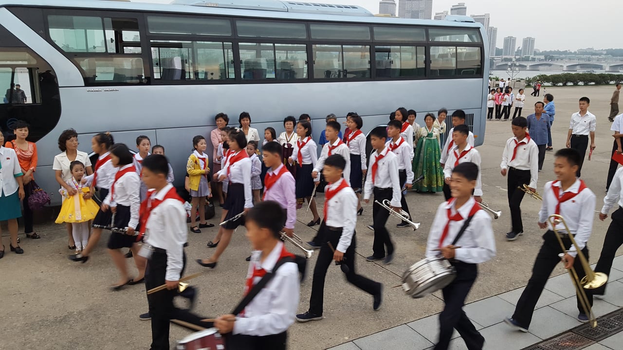School children marching band near the Juche Tower.