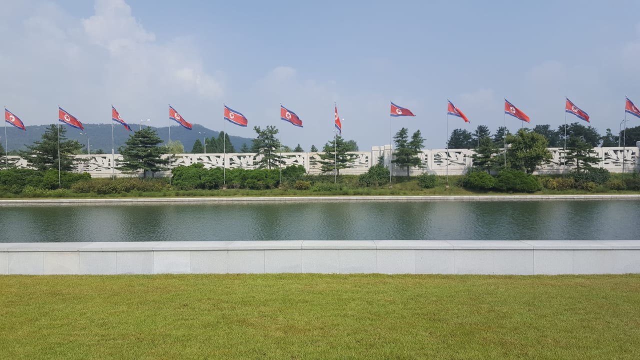 Flags in front of the Kumsusan Palace of the Sun.