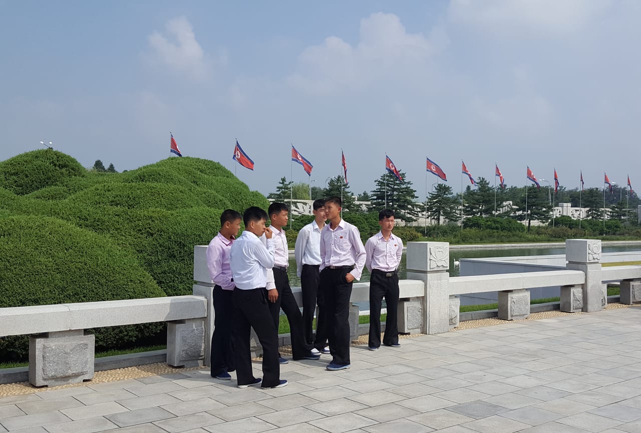 Young men grouped at Kumsusan.