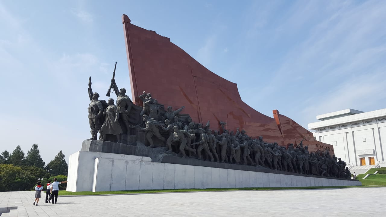 A monumental mural at the left.
