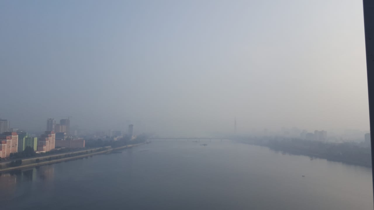 View of Pyongyang looking north up the Taedong river from our Yanggakdo International Hotel rooftop.