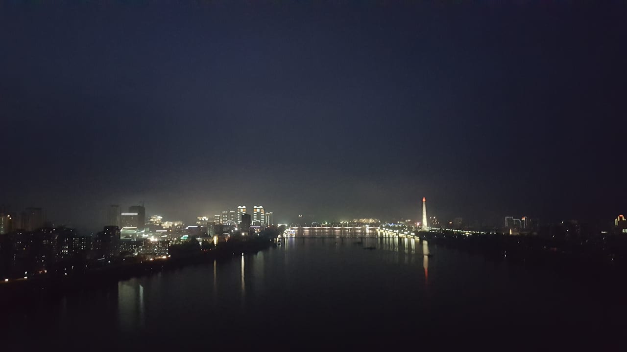 Same view looking north up the Taedong river at night.